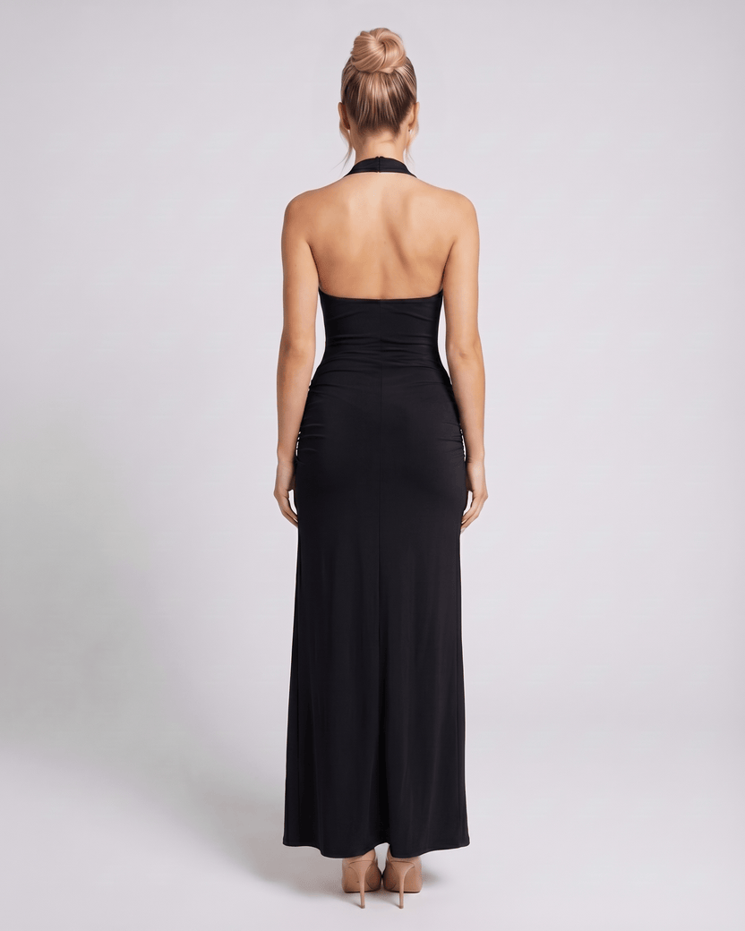 Back view of Lauven's black v-neck maxi dress, highlighting its sleek design and modern halter cut.