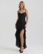 Nocturne Maxi Dress featuring sheer ruffle hem and refined black satin fabric by Lauven for an elegant evening look.