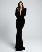 Nocturne Maxi Dress showcasing a sleek black velvet silhouette with deep V-neck and long sleeves by Lauven.