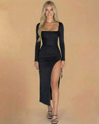 Model wearing Nocturne Midi Dress by Lauven, showcasing a square neck, long sleeves, and side slit for sophisticated elegance.