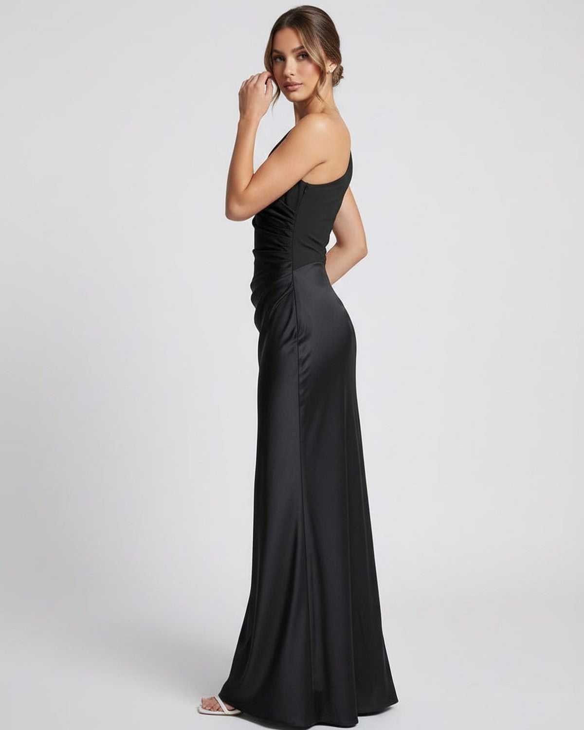 Noelle Maxi Dress showcasing a one shoulder design, sleek satin finish, and high waist silhouette. Lauven brand.