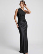 Noelle Maxi Dress | Black one shoulder maxi dress by Lauven featuring a sleek silhouette and satin-like finish.