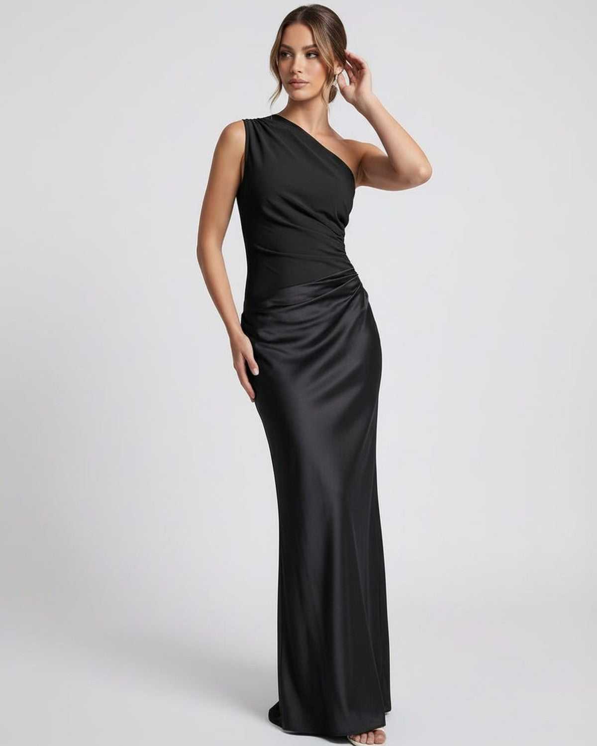 Noelle Maxi Dress | Black one shoulder maxi dress by Lauven featuring a sleek silhouette and satin-like finish.