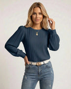 Noir Blouse by Lauven, elegant navy pleated long sleeve top styled with high-waisted jeans.