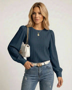 Noir Blouse by Lauven, a classic black pleated long sleeve top for versatile style and elegance.