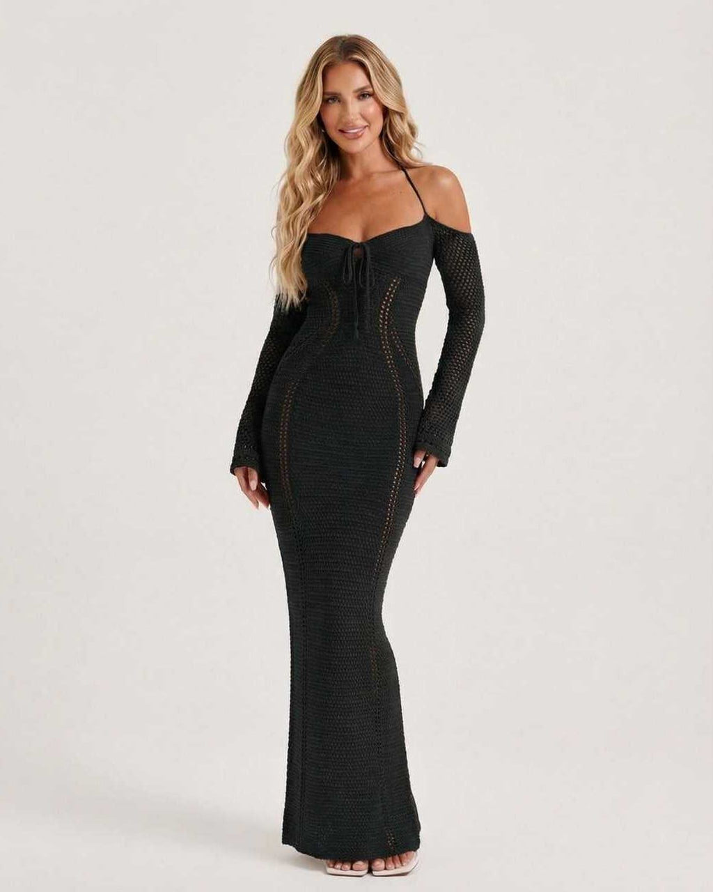 Noir Maxi Dress by Lauven featuring black long sleeve bodycon design, open back, and refined openwork detailing.