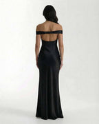 Noir Maxi Dress: Elegant black satin maxi dress with off shoulder design showcasing a sleek silhouette by Lauven.