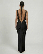 Noir Maxi Dress by Lauven showcasing a sleek sleeveless design and dramatic backless cut.