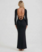 Lauven Noir Maxi Dress featuring an elegant open back and long sleeves in luxurious black fabric.