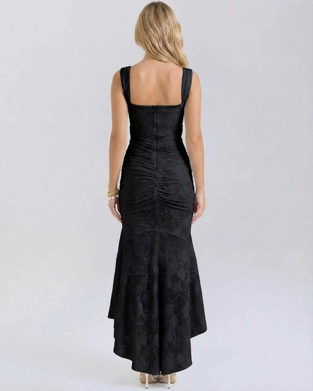 Noir Maxi Dress by Lauven showing back view with pleated details and fish tail hem in black.