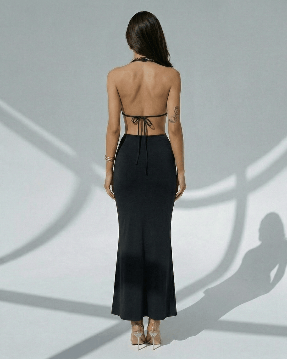 Noir Maxi Dress by Lauven, elegant black bodycon with deep V-neck, adjustable waist, sleek design.