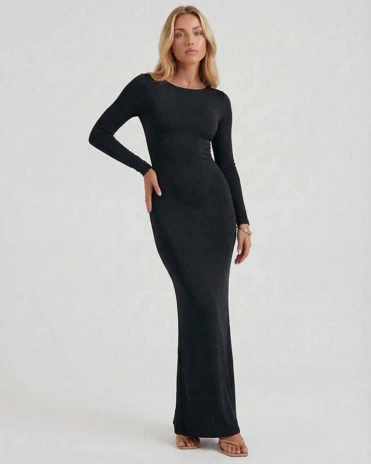 Elegant Lauven Noir Maxi Dress in black, featuring long sleeves and an open back design for formal occasions.