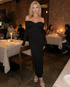 Noir Maxi Dress by Lauven – Elegant off-shoulder sheath silhouette in a sleek black fabric.