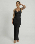 Noir Maxi Dress by Lauven - Sleek black bodycon dress with spaghetti straps and backless design.
