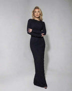 Noir Maxi Dress by Lauven — Textured black long sleeve knitted dress showcasing a flattering silhouette.