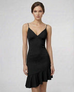 Noir Mini Dress by Lauven - Sleek black A-line with ruffle detail, showcasing a flattering silhouette.