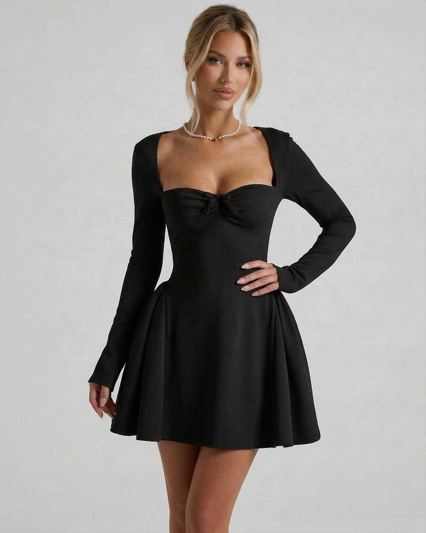 Noir Mini Dress by Lauven features a square neckline, long sleeves, ruched bow detail, and a flared silhouette in elegant black.