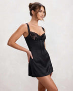 Noir Mini Dress by Lauven, black satin with lace detail, V neck, above-knee length, sleek and fitted look.