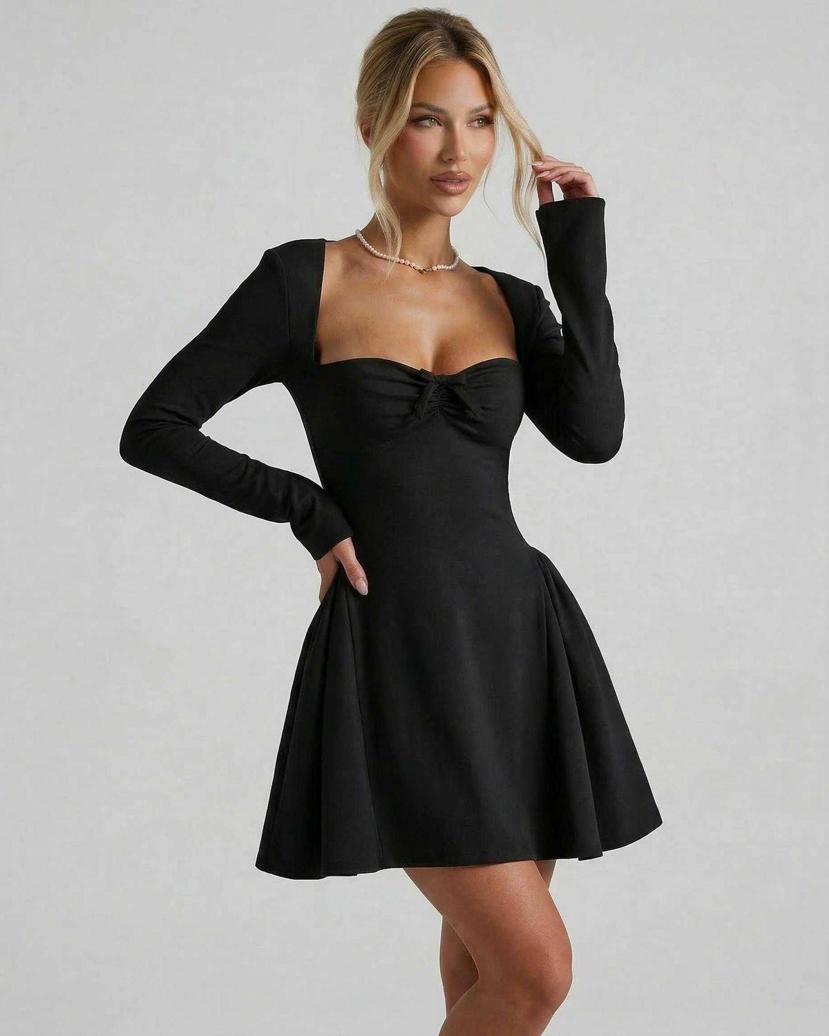 Noir Mini Dress, elegant black long sleeve design, flattering fit-and-flare silhouette by Lauven.