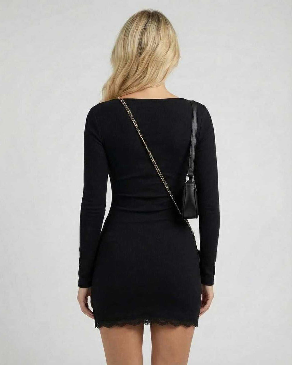 Noir Mini Dress showcasing back view with long sleeves, lace trim, sleek silhouette, by Lauven.