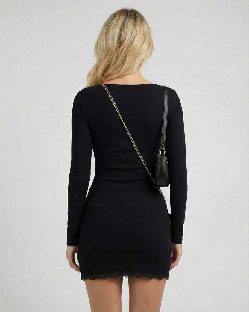 Noir Mini Dress showcasing back view with long sleeves, lace trim, sleek silhouette, by Lauven.