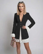 Noir Mini Dress by Lauven, featuring ruffle cuffs, deep V-neck, sleek silhouette, and elegant finish.