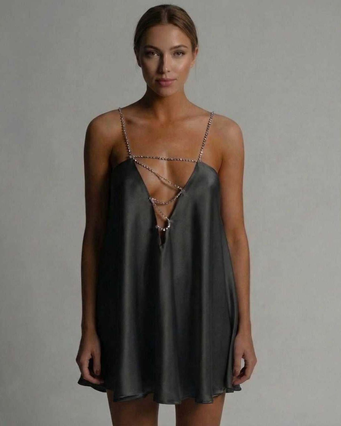 Lauven Noir Mini Dress in satin featuring a hollow V-neckline and beaded straps for a modern look.