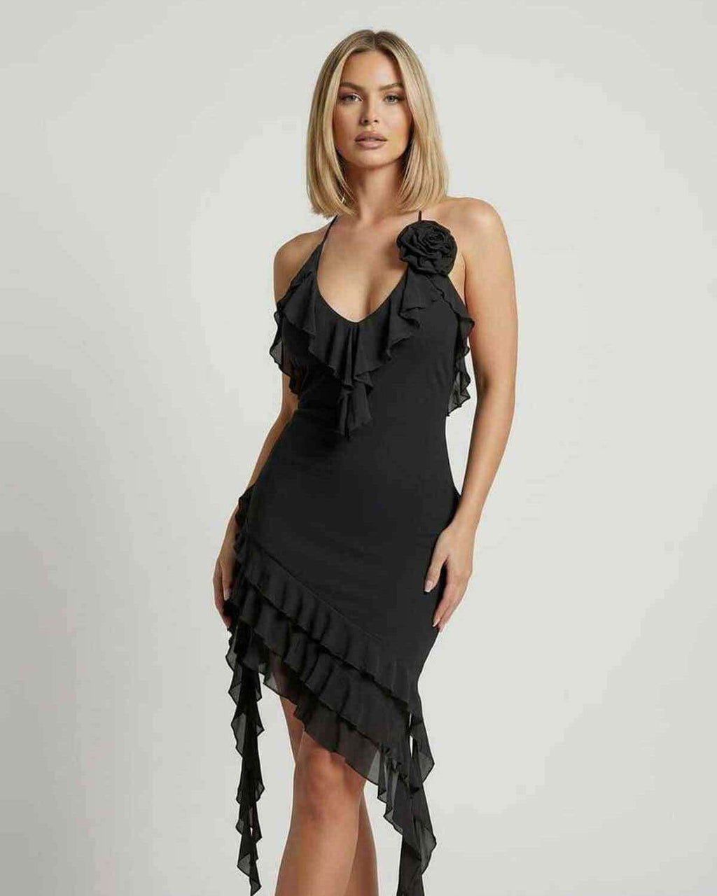 Noir Mini Dress by Lauven featuring romantic ruffles and an asymmetrical hemline in classic black.
