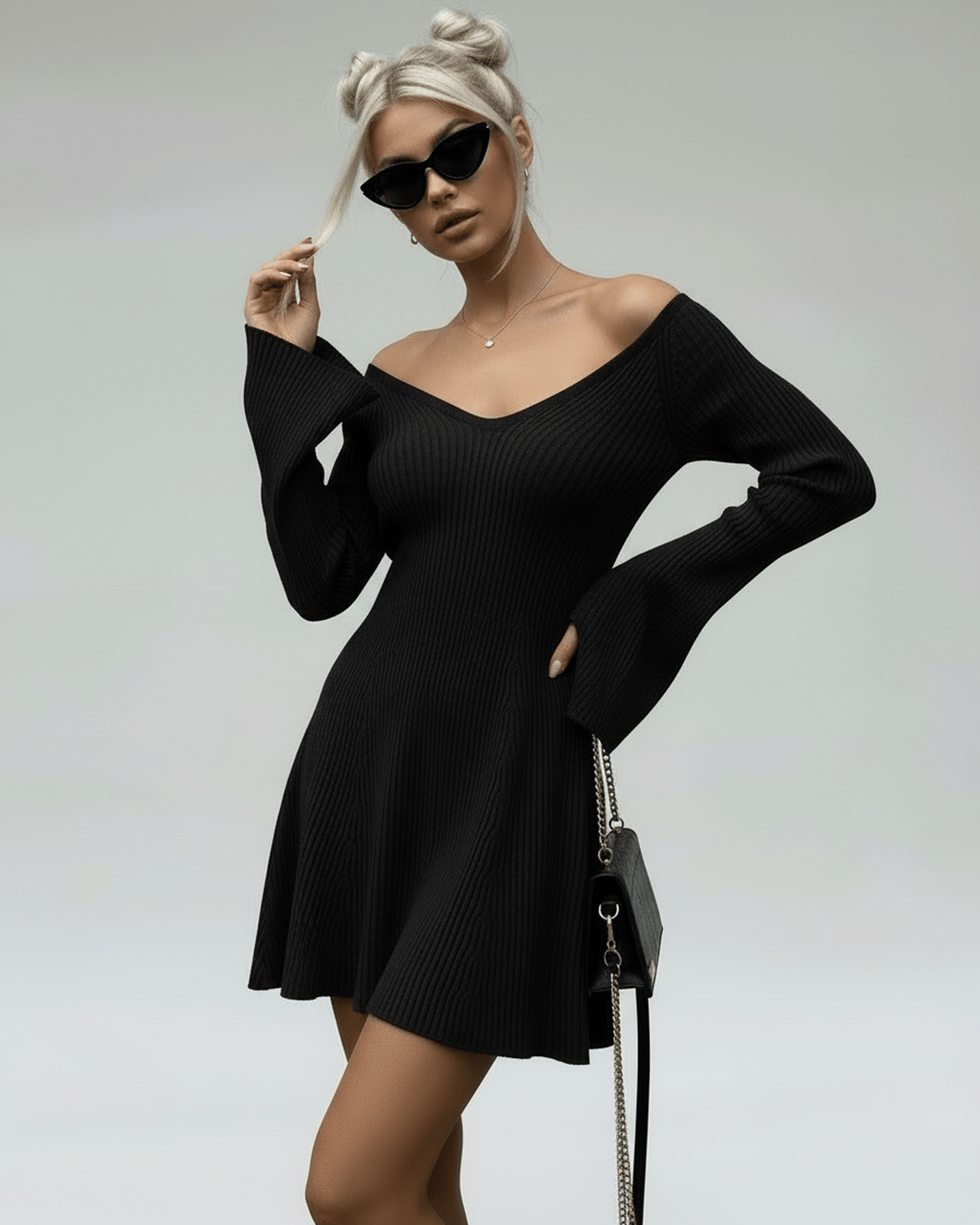 Noir Mini Dress by Lauven, a slim fit black knit dress with V-neck and flared sleeves for a modern look.