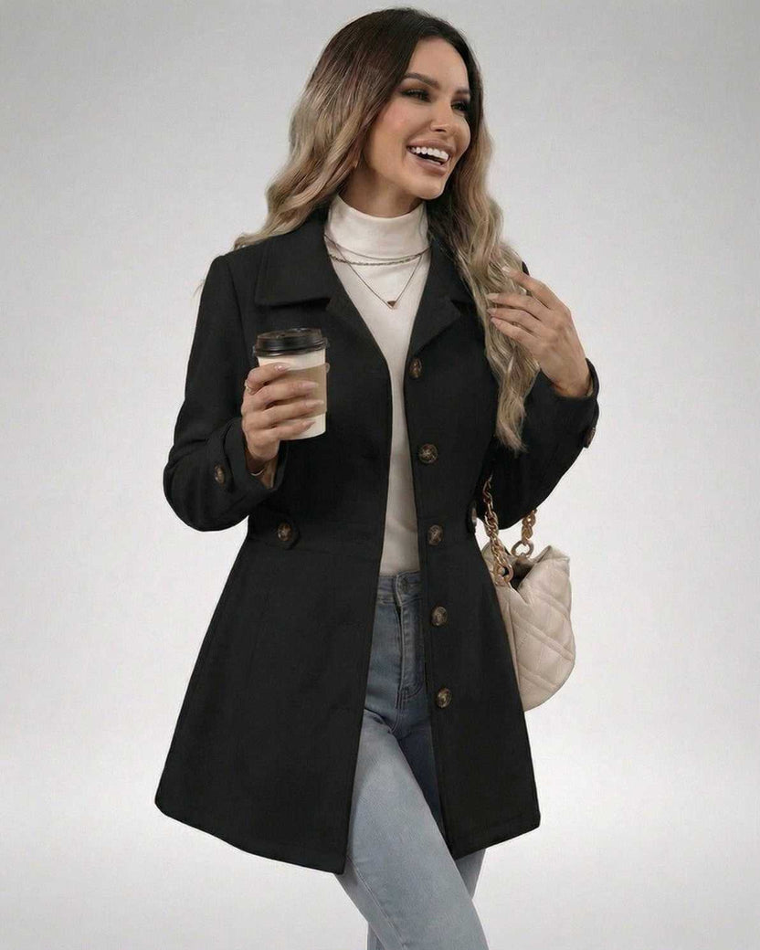 Woman wearing Noir Sculpt Jacket by Lauven while holding a coffee, showcasing a stylish, feminine look.