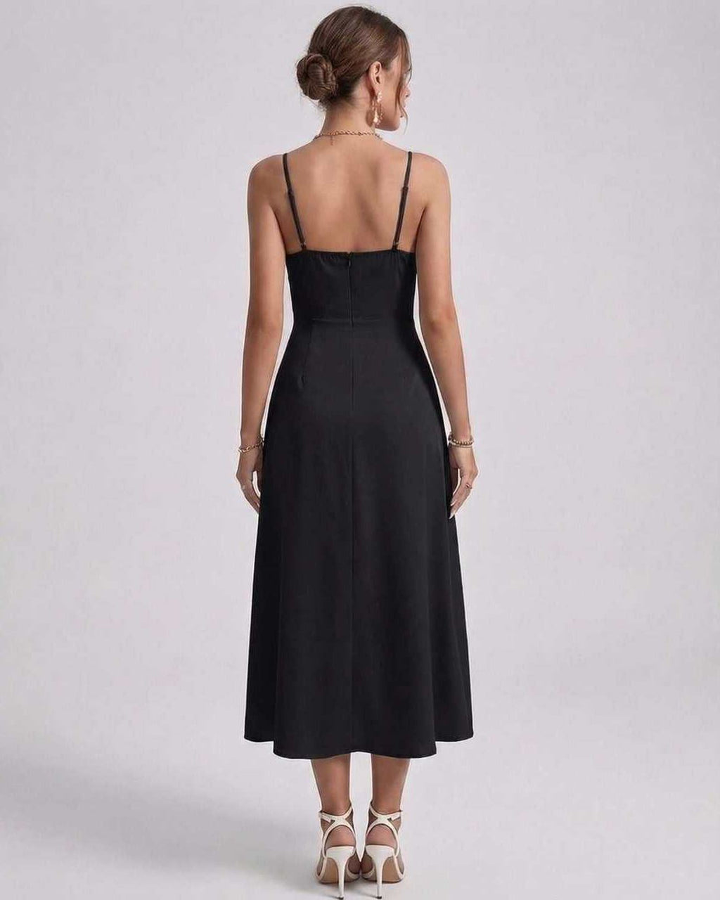 Noiré Midi Dress back view featuring sleek satin finish and delicate spaghetti straps for elegant occasions by Lauven.