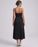 Noiré Midi Dress back view featuring sleek satin finish and delicate spaghetti straps for elegant occasions by Lauven.