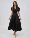 Noire Midi Dress showcasing elegant black fabric, deep V-neck, puff sleeves, perfect for weddings by Lauven.