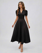 Noire Midi Dress showcasing elegant black fabric, deep V-neck, puff sleeves, perfect for weddings by Lauven.