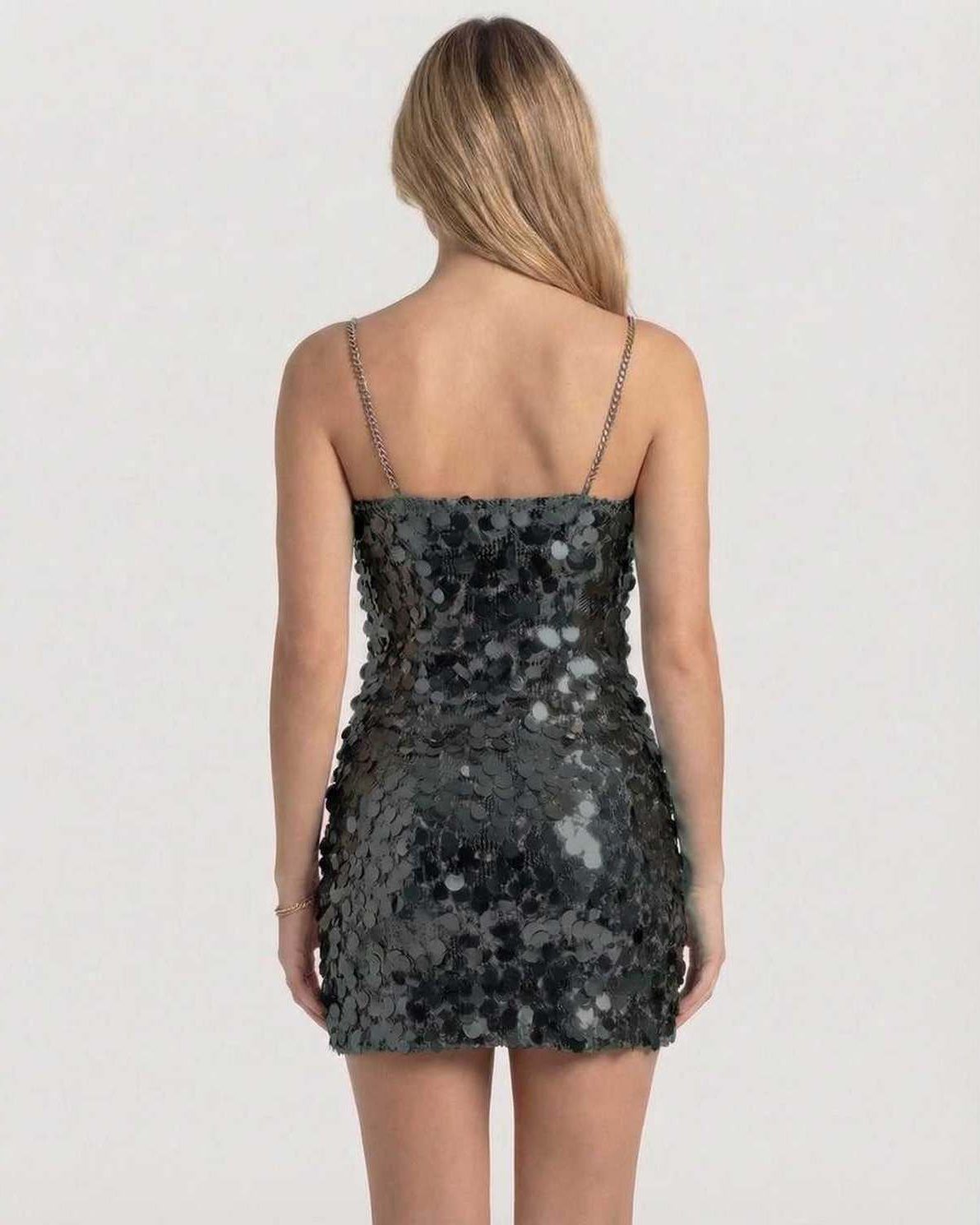 Noiré Mini Dress back view, black sequin bodycon silhouette by Lauven, featuring chain straps for a chic evening look.