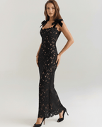 Elegant black lace maxi dress by Lauven, featuring a square neck, shoulder ties, and a refined texture.