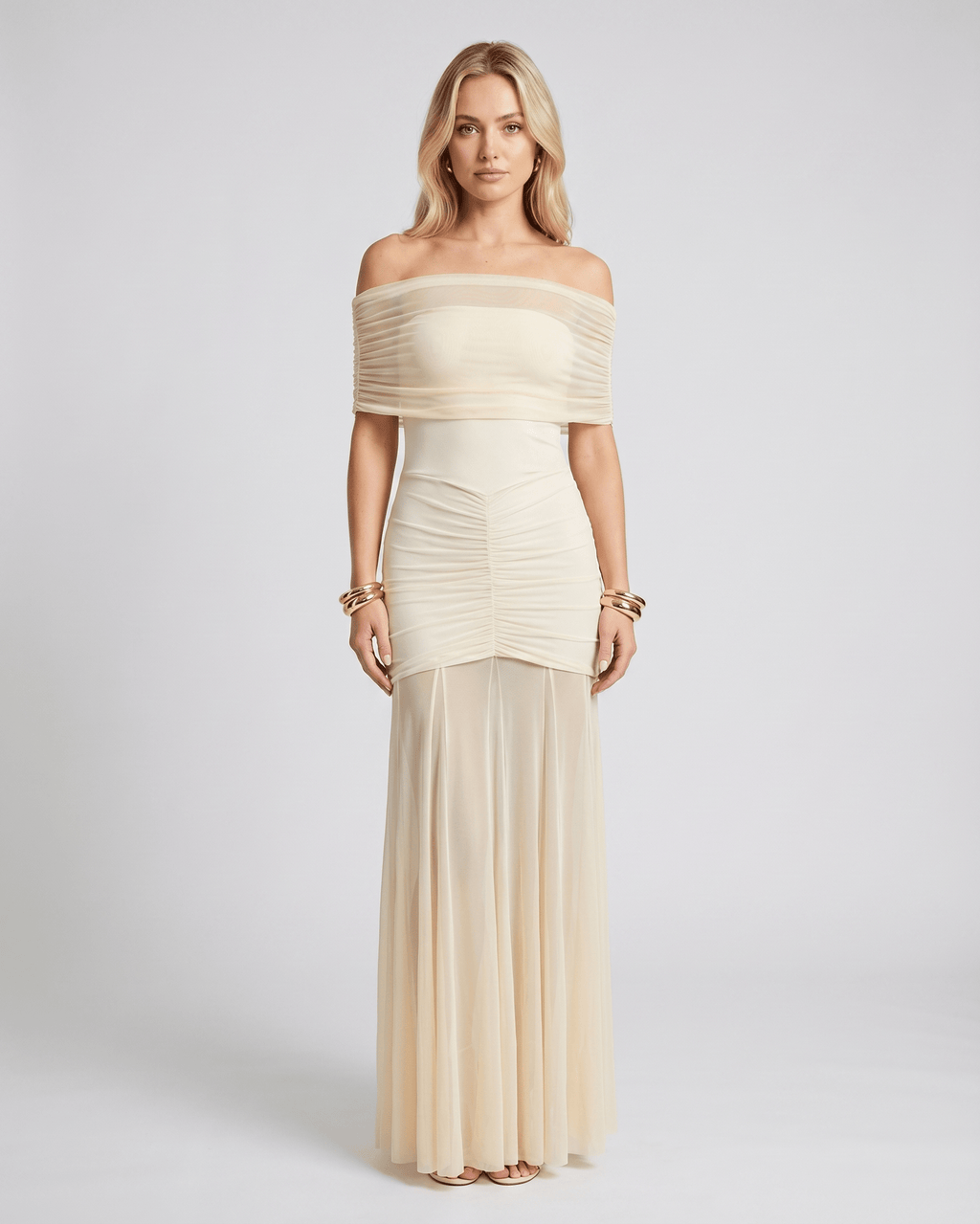 Noirline maxi dress by Lauven, featuring off-shoulder neckline, ruched bodice, elegant flowing sheer panel, and stunning movement.