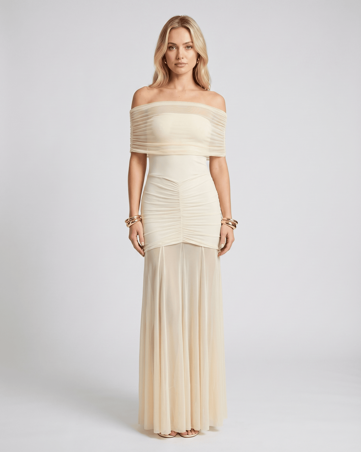 Noirline maxi dress by Lauven, featuring off-shoulder neckline, ruched bodice, elegant flowing sheer panel, and stunning movement.
