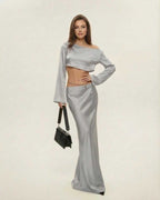 Nova Midi Dress by Lauven, featuring a chic asymmetrical design in sleek silver, perfect for elegant occasions.
