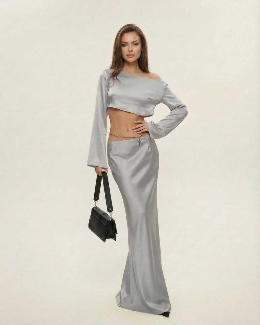 Nova Midi Dress by Lauven, featuring a chic asymmetrical design in sleek silver, perfect for elegant occasions.