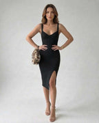 Nova Midi Dress featuring a black sheath style with side slit, by Lauven for a modern and elegant look.