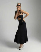 Nova Midi Dress by Lauven – Elegant cutout halter dress showcasing modern style for evening events.