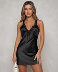 Nova Mini Dress by Lauven — Sleek black satin with lace back detail and deep V-neckline.