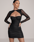 Nova Mini Dress by Lauven in classic black with sheer long sleeves and ruched bodice detailing.