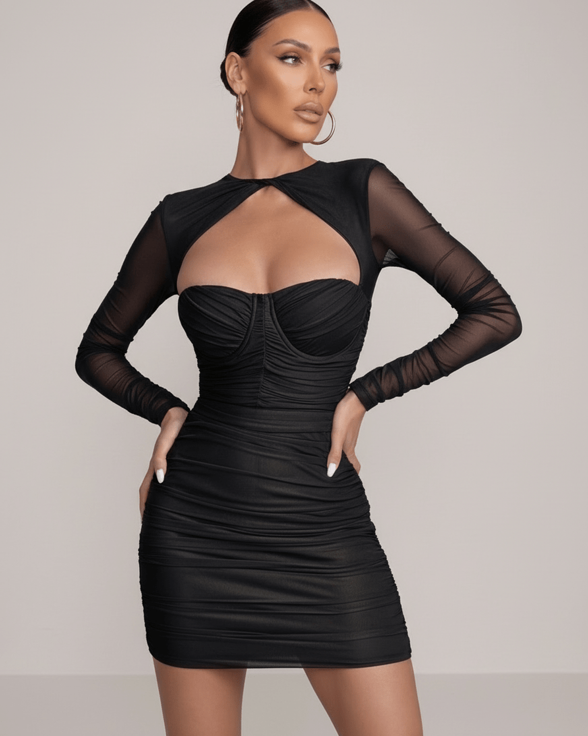 Nova Mini Dress by Lauven in classic black with sheer long sleeves and ruched bodice detailing.