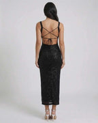 Back view of Nyra Midi Dress by Lauven showcasing its sequined elegance and stylish backless design.