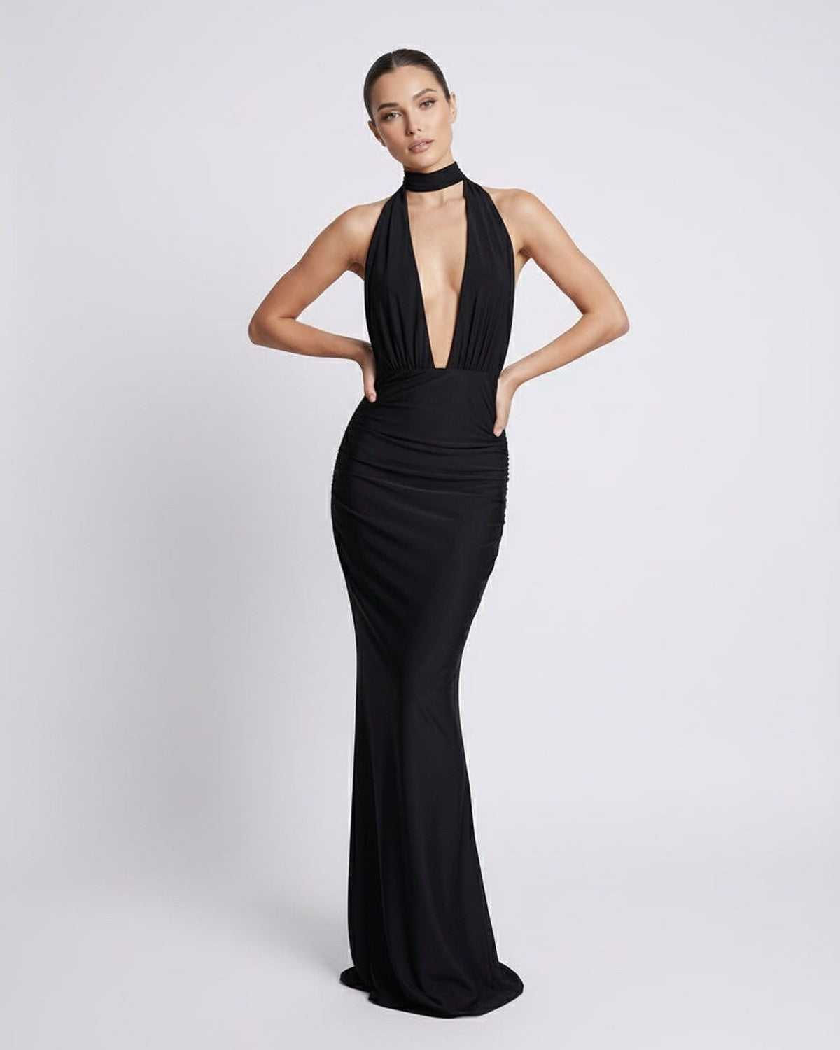 Nyx Maxi Dress featuring a black halter design, deep plunge, and open back, crafted by Lauven for modern elegance.