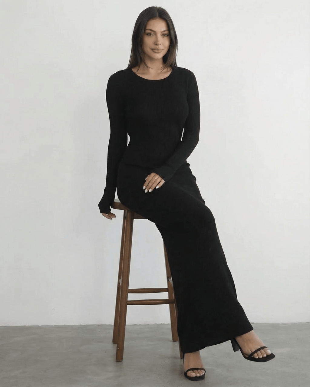 Nyx Maxi Dress by Lauven: Long sleeve black dress with open back, sleek silhouette, and ankle-length design.