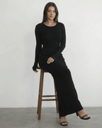 Nyx Maxi Dress by Lauven: Long sleeve black dress with open back, sleek silhouette, and ankle-length design.