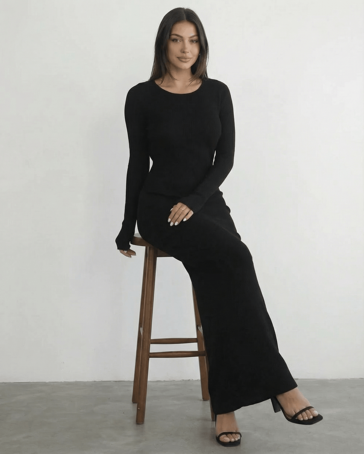 Nyx Maxi Dress by Lauven: Long sleeve black dress with open back, sleek silhouette, and ankle-length design.